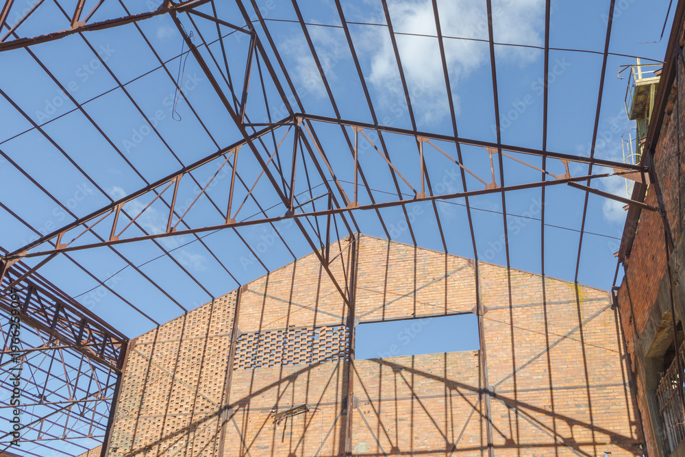 Fototapeta premium Abandoned Lousal Mining Museum structure with exposed steel roof