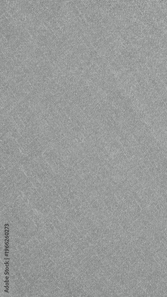 Fototapeta premium Gray textured fabric background, featuring a subtle woven pattern. The gray background adds a soft, elegant touch to designs. Gray textured mobile phone wallpaper with copy space.