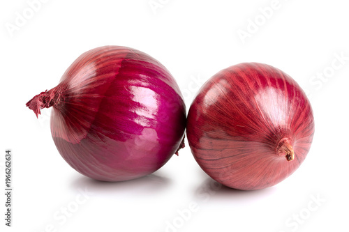 Two organic raw red onions with purple skin.  Culinary ingredient for healthy cooking and food styling, captured from a side view on a clean white background.