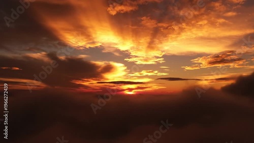 Dramatic Sunset Sky with Clouds and Orange Glow.