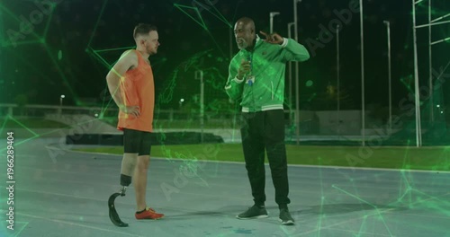 Coach tapping, cueing athlete testing blade and striding, training, green overlay around blade