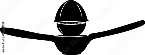 Sleek black silhouette of a manual citrus juicer with a fresh lemon half ready for squeezing, symbolizing freshness and healthy living.