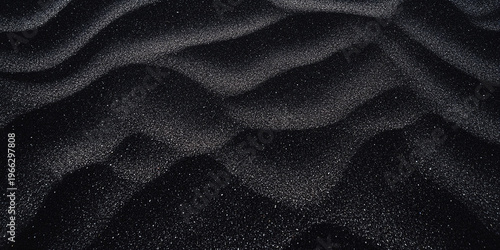 Background with black sand and white specks