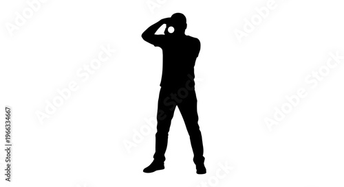 Silhouette of a man taking a photo with a camera