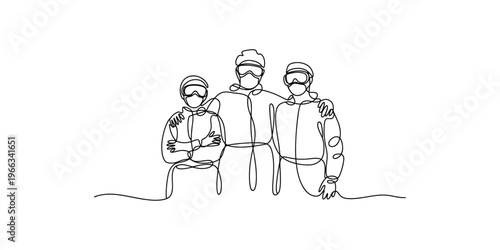 Three friends standing together wearing ski gear and protective face masks group