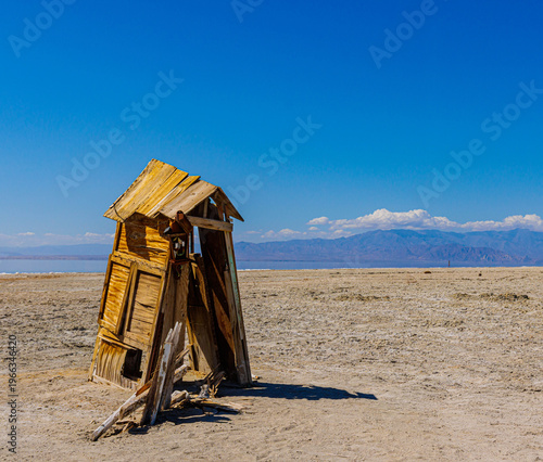 Small Broken Shed on The Dry Shoreline of The Salton Sea With The Santa Rosa Mountains in The Distance, Bombay Beach, California, USA