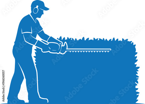 Landscaper trimming hedge with power trimmer