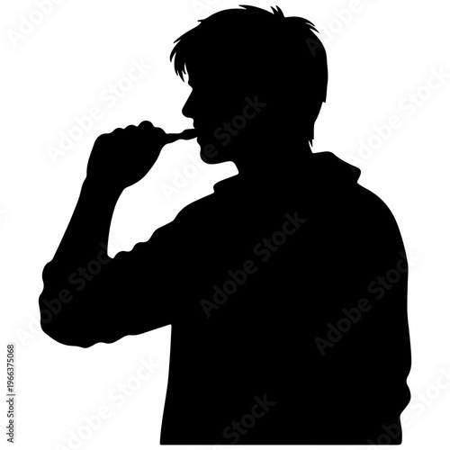 Silhouette of a young man brushing teeth with a toothbrush