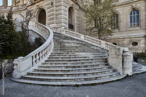 Monumental neoclassical fountain, staircase and colonnade in a grand European civic complex