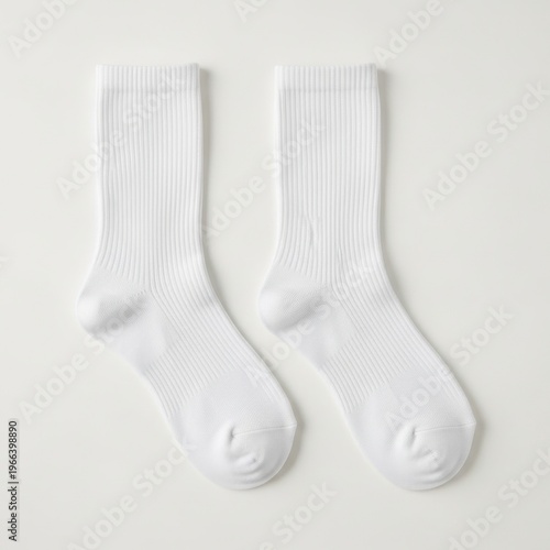 A pair of white ribbed knit socks with reinforced toes and heels