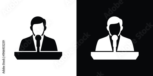 Black and white men in suits speaking at podiums microphones