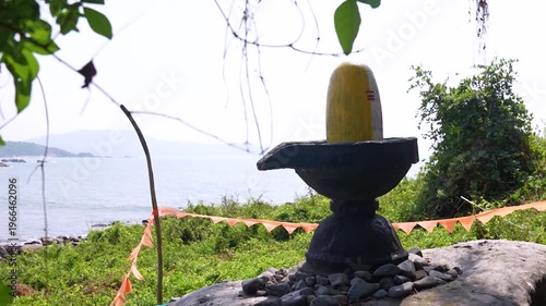 Big Shivling near beach in Karwar Karnataka.Shiva lingam surrounded by trees near coastline India.