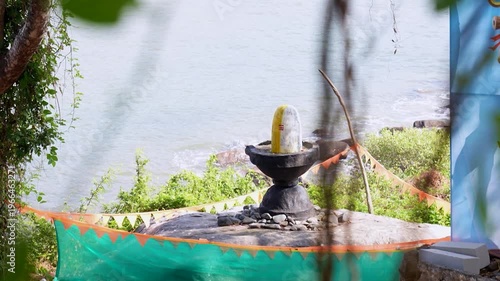 Big Shivling near beach in Karwar Karnataka.Shiva lingam surrounded by trees near coastline India.
