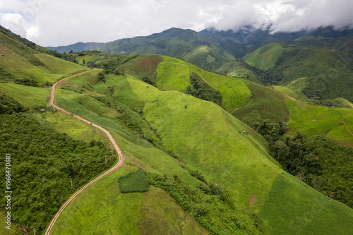 Landscape of Morning Mist with Mountain Layer. mountain ridge and clouds in rural jungle bush forest