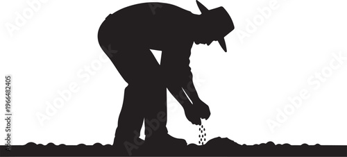 Man in silhouette planting seeds in the ground outside