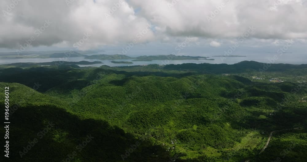 custom made wallpaper toronto digitalLush mountain slopes covered in dense forest leading to sea horizon with visible islands. Siargao, Philippines.