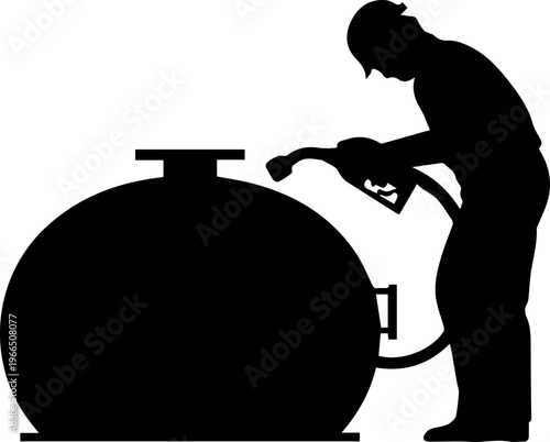 Black Silhouette of an Industrial Worker Filling a Large Fuel Storage Tank with a Gas Pump Nozzle