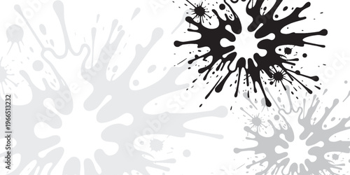 Abstract graphic design featuring black and grey ink splatters on a white background, creating a dynamic and artistic texture.