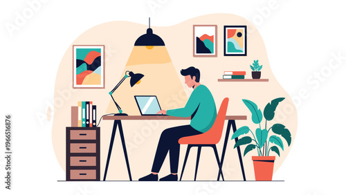 Young man focused on working on his laptop at a modern home office desk with lamps, plants, and wall art in a cozy interior.