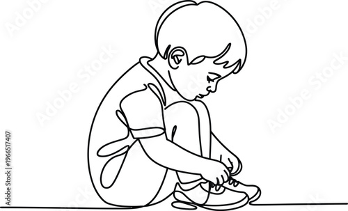A black and white line drawing of a young boy sitting on the ground tying his shoelaces