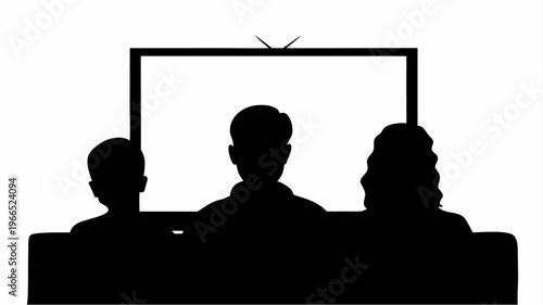 Family watching tv together in silhouette indoors at home