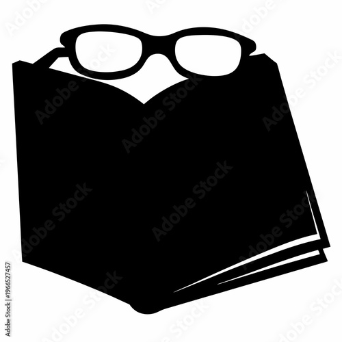 Silhouette illustration of an open book with glasses on top for reading