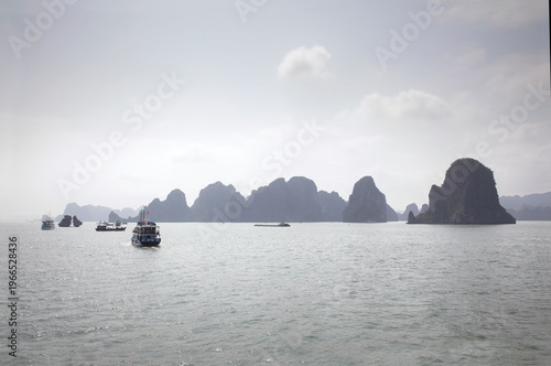 Misty sunrise over the limestone islands in Ha Long Bay, Vietnam.