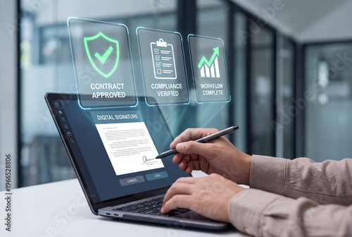 A person uses a stylus to sign a digital document on a laptop screen with holographic approval and compliance icons floating in the air.