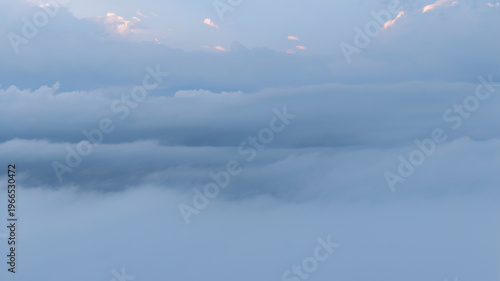 Photography A Spring clouds drifting above hidden skyline