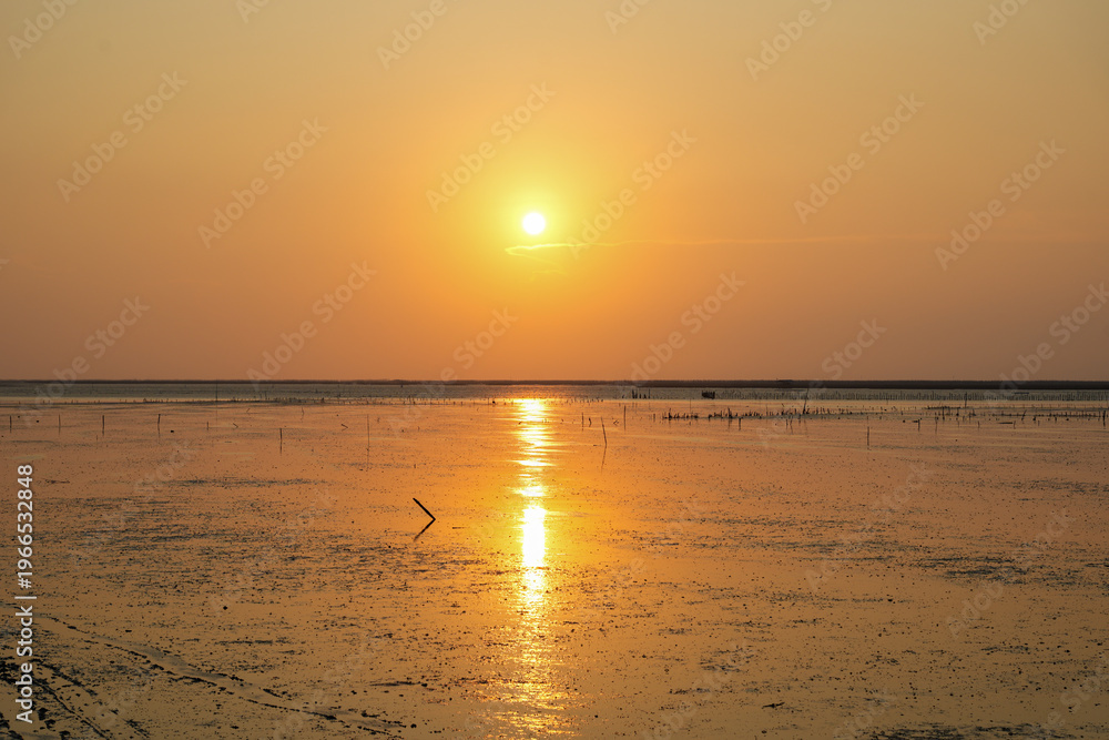 Obraz premium Natural Sunset Sunrise Over Sea, Bright Dramatic Sky And Dark Ground. Countryside Landscape Under Scenic Colorful Sky At Sunset Dawn Sunrise. Sun Over Skyline, Horizon. Warm Color.