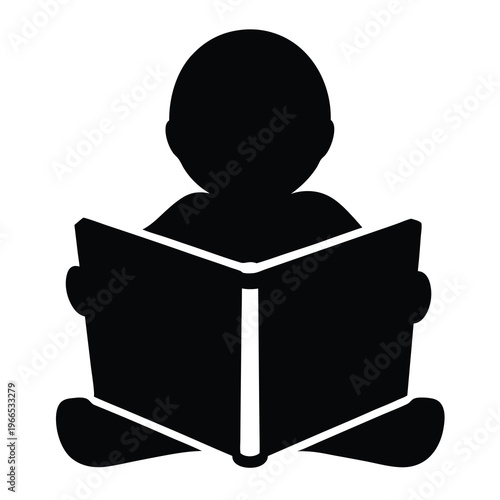 Black silhouette of a young child reading a book cross legged