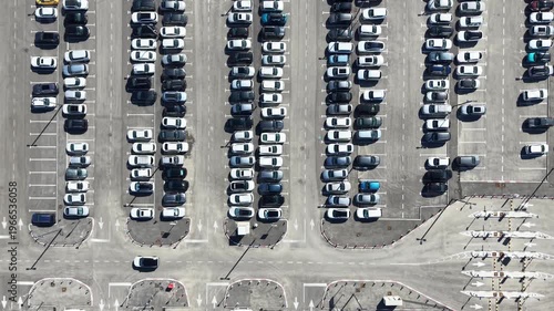 Public parking lot with Cars searching for parking spots