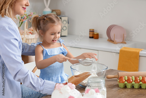 Happy little daughter and m...