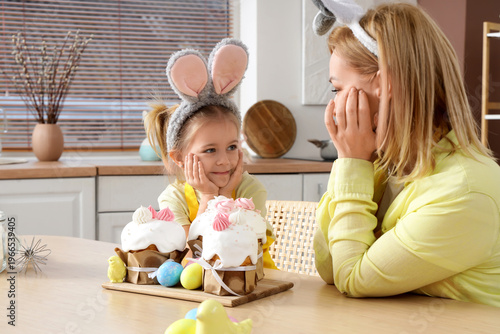 Happy little daughter and m...