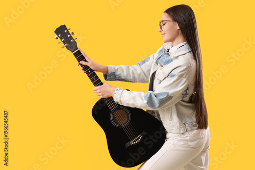 Young girl with guitar on y...
