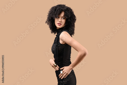 Beautiful young woman in cu...