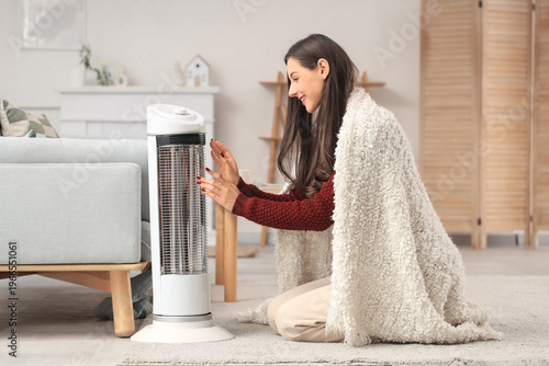 Young woman with plaid warm...