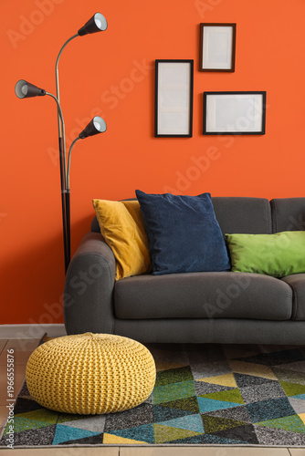 Comfortable sofa, pouf and ...