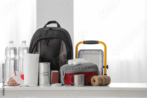 Photos Emergency backpack with necessities on table in room