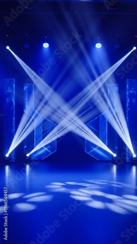 Bright blue stage lights shining in a dark theater