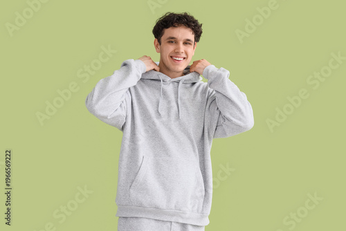 Young man in grey sports su...