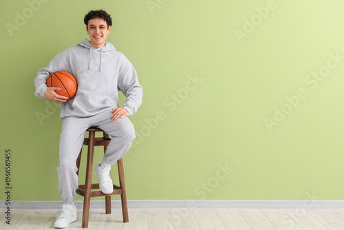 Young man in grey sports su...
