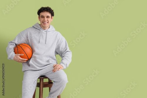 Young man in grey sports su...
