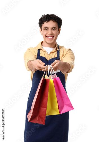 Young male cashier with sho...