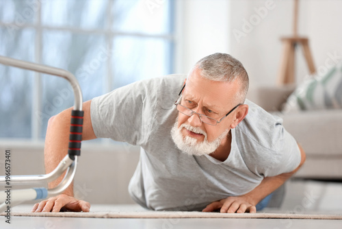 Senior man lying after fall...