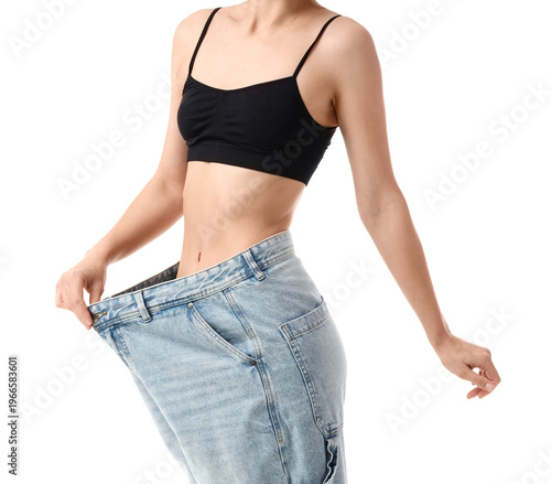 Young woman in loose jeans ...