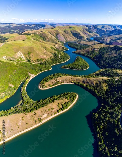 Aerial view of a winding river through green landscape (1)