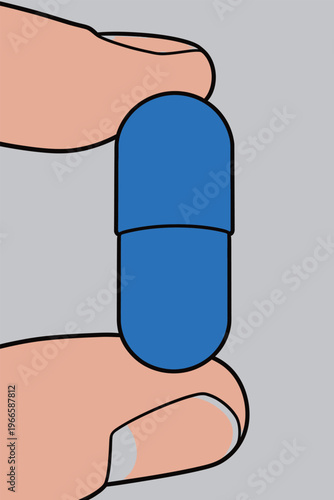 Holding a blue capsule between fingers with a plain gray background in a simple setting during daytime