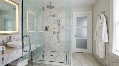 Marble bathroom interior featuring glass shower enclosure with rainfall faucet fixtures, washbasin vanity area, white robe hanging, bright home spa.