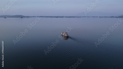 Vientiane, Laos - January 17, 2026: Yacht moving in the Nam Ngum Lake near Vientiane.
